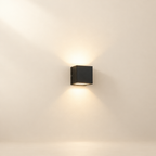 Adjustable Angle Outdoor Wall Sconce on a bright warm cream studio backdrop