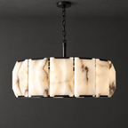 Round Alabaster Chandelier with Black Steel Frame on a dark charcoal grey studio ceiling backdrop