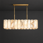 Linear Alabaster Chandelier with Brass Beam on a dark charcoal grey studio ceiling backdrop