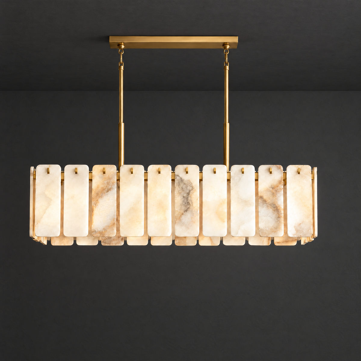 Linear Alabaster Chandelier with Brass Beam on a dark charcoal grey studio ceiling backdrop