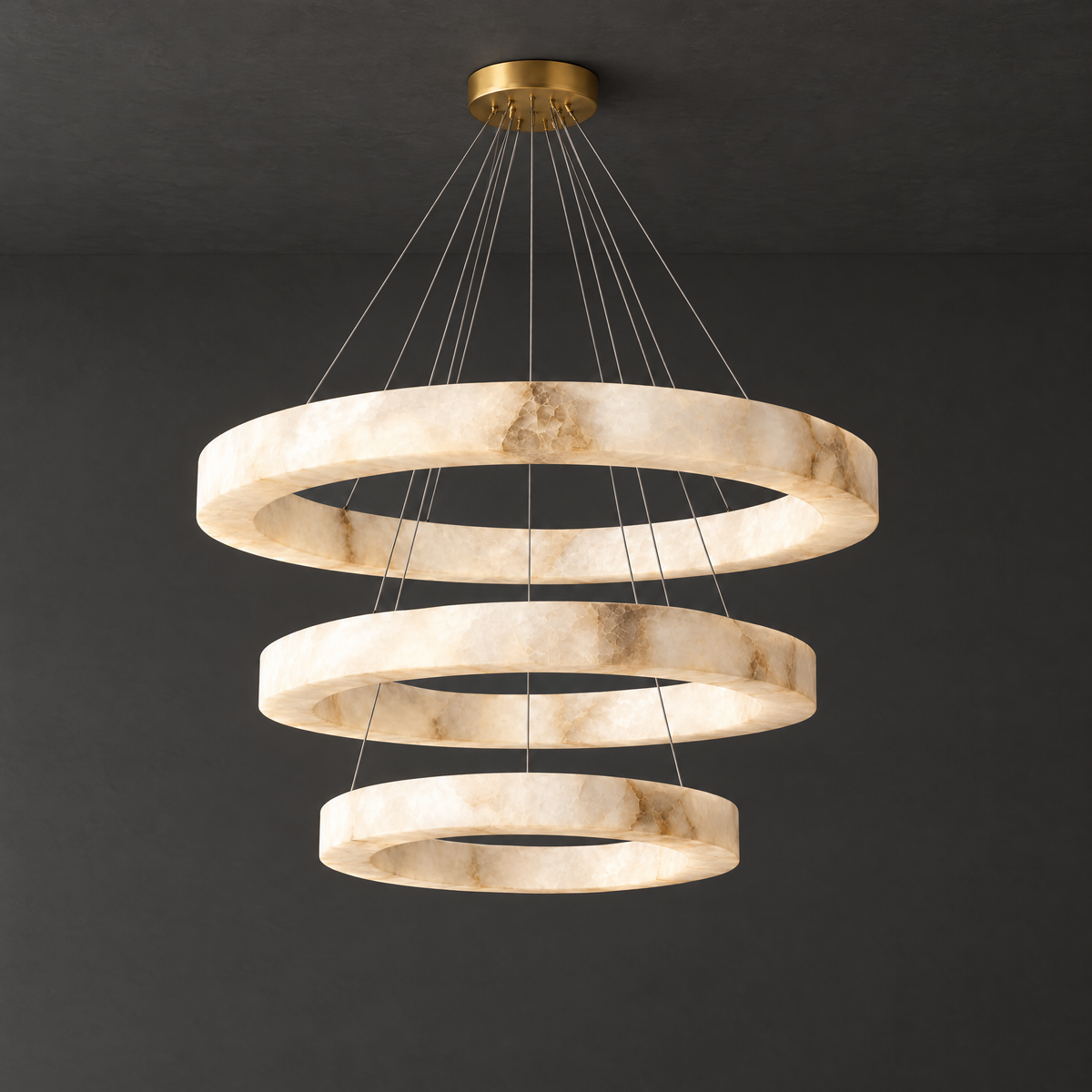 Grand Three-Ring Alabaster LED Chandelier on a dark charcoal grey studio ceiling backdrop