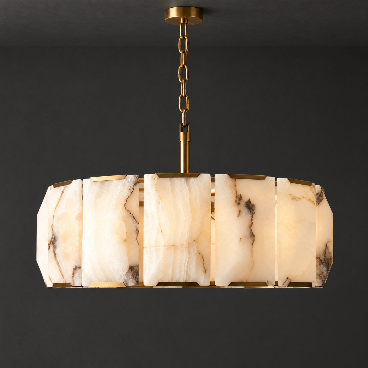 Round Alabaster Chandelier with Brass Frame on a dark charcoal grey studio ceiling backdrop