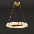 Single-Ring Alabaster LED Chandelier on a dark charcoal grey studio ceiling backdrop