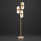 Brass Floor Lamp with Layered Glass Shades on a dark charcoal grey studio backdrop