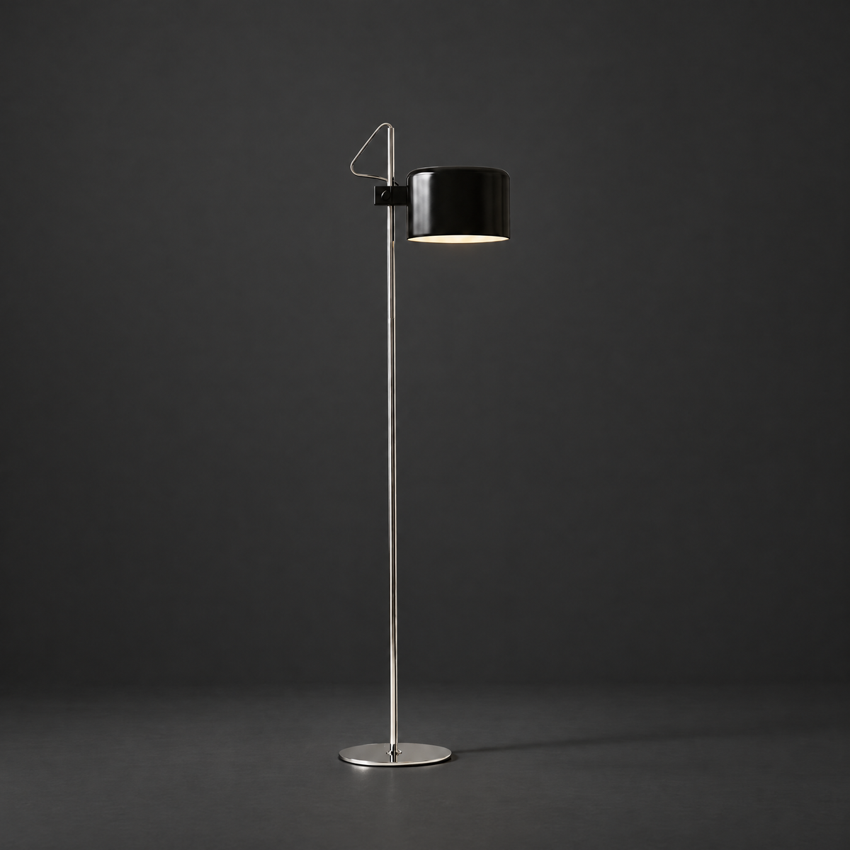 Adjustable Black Arc Floor Lamp on a dark charcoal grey studio backdrop