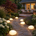 Solar Pebble Stone Garden Lights in a styled outdoor setting