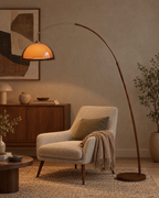 Adjustable Arc Floor Lamp with Warm Dome Shade in a styled room setting
