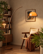 Adjustable Arc Floor Lamp with Warm Dome Shade in a styled room setting