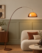 Adjustable Arc Floor Lamp with Warm Dome Shade in a styled room setting