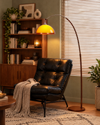 Adjustable Arc Floor Lamp with Warm Dome Shade in a styled room setting