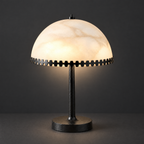 Alabaster Dome Table Lamp with Scalloped Steel Trim on a dark charcoal grey studio backdrop