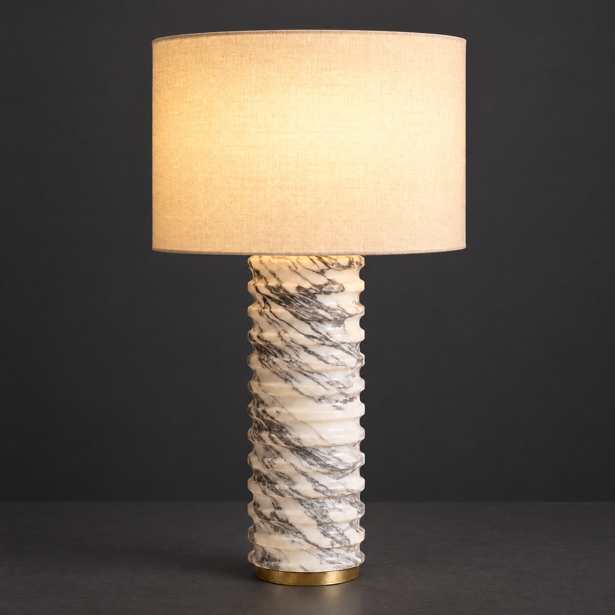 Ribbed Marble Table Lamp with Ivory Shade on a dark charcoal grey studio backdrop