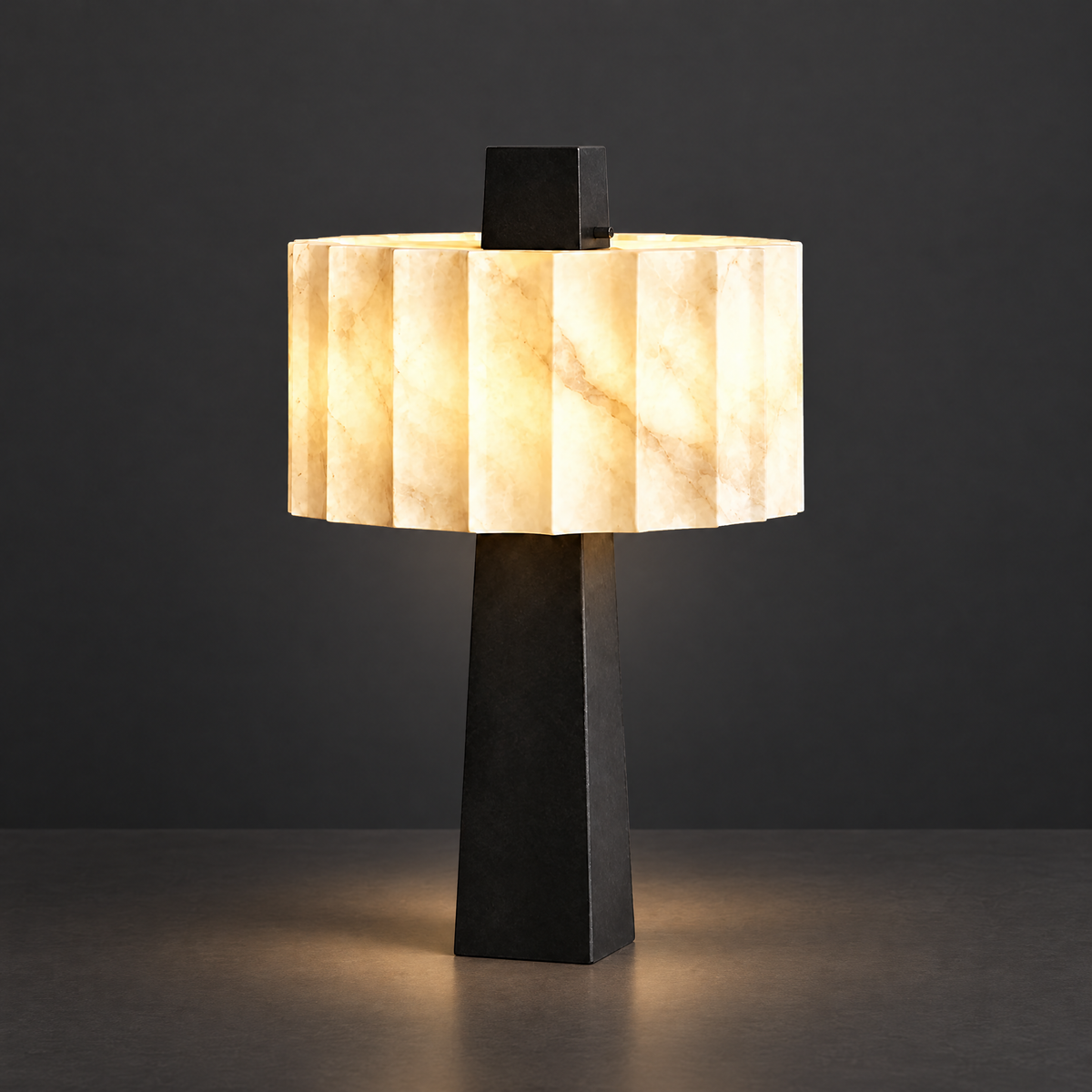 Fluted Alabaster Table Lamp with Black Base on a dark charcoal grey studio backdrop