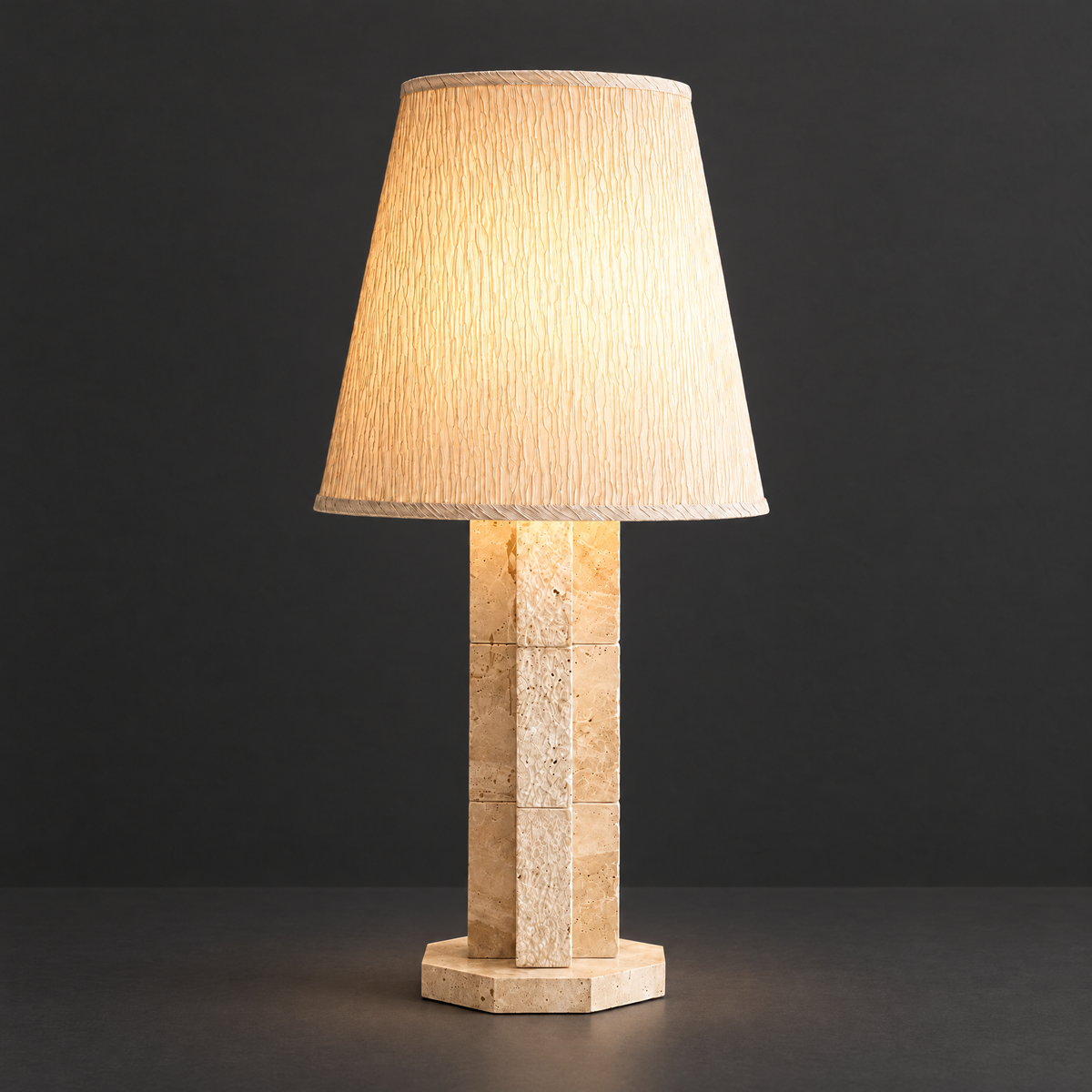 Travertine Block Table Lamp with Textured Shade on a dark charcoal grey studio backdrop