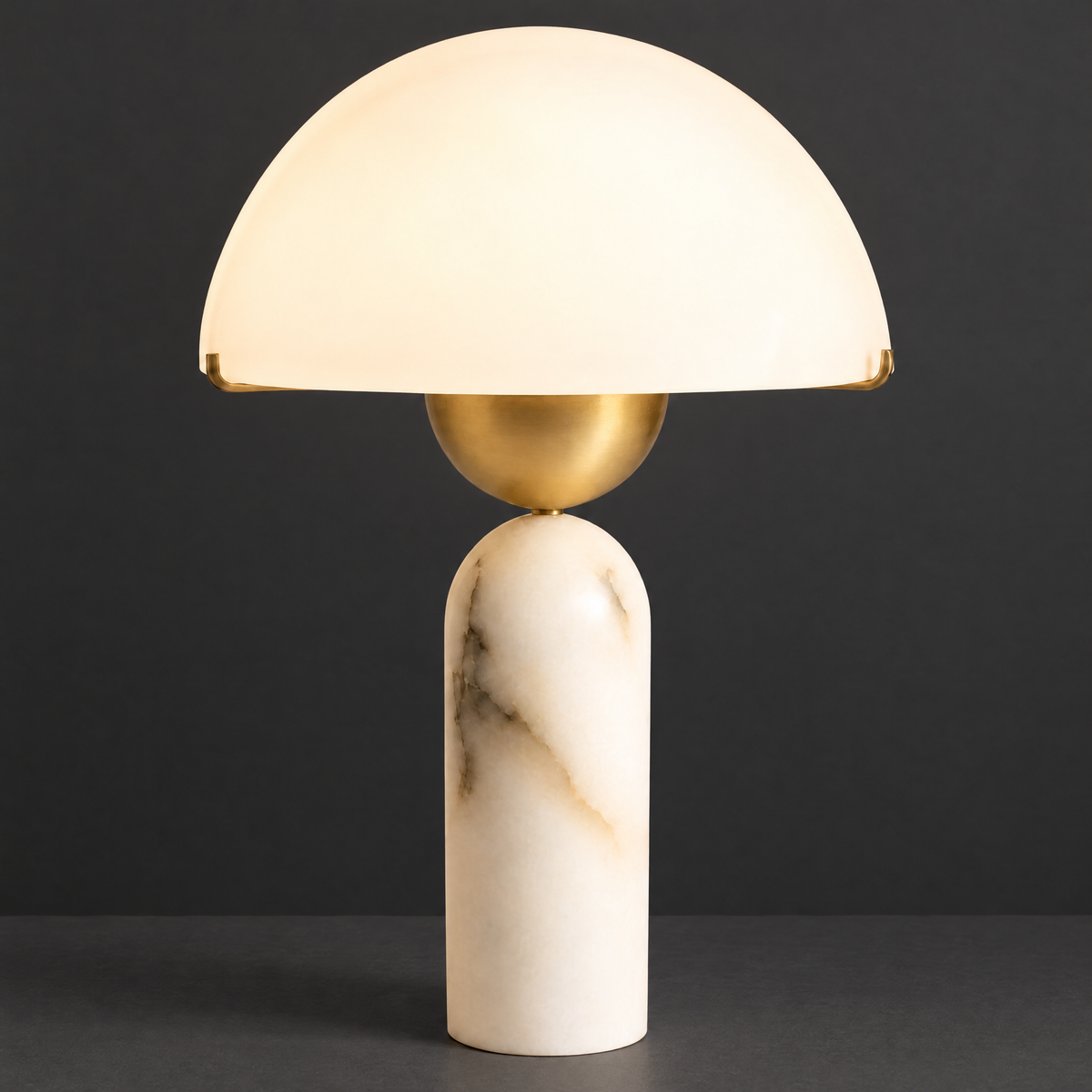Marble Table Lamp with Brass Stem and Half-Dome Shade on a dark charcoal grey studio backdrop