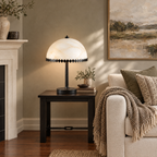 Alabaster Dome Table Lamp with Scalloped Steel Trim in a styled room setting