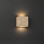 Travertine Wall Sconce for Indoor and Outdoor on a dark charcoal grey studio backdrop